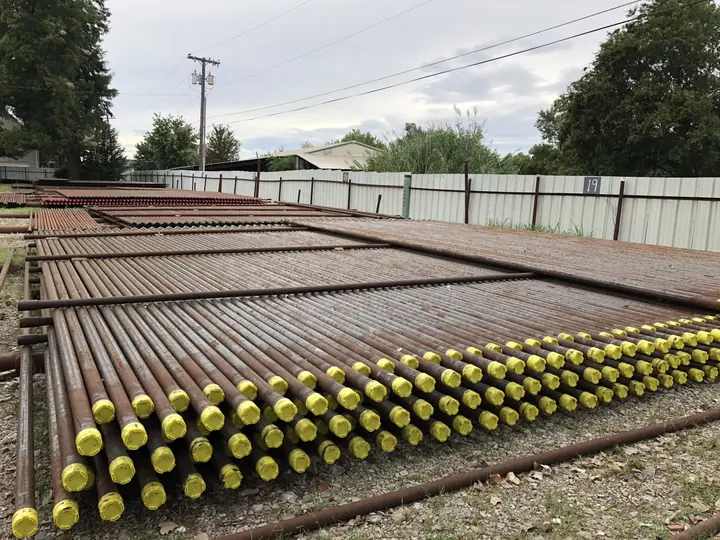 Pipe stock along the fence line at the Reddy Pipe yard