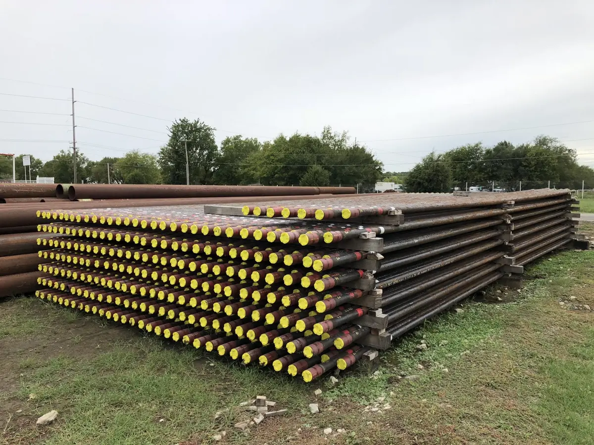 Pipe on racks with thread protectors in the Reddy Pipe yard, Tulsa