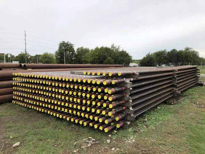Pipe on racks with thread protectors in the Reddy Pipe yard, Tulsa